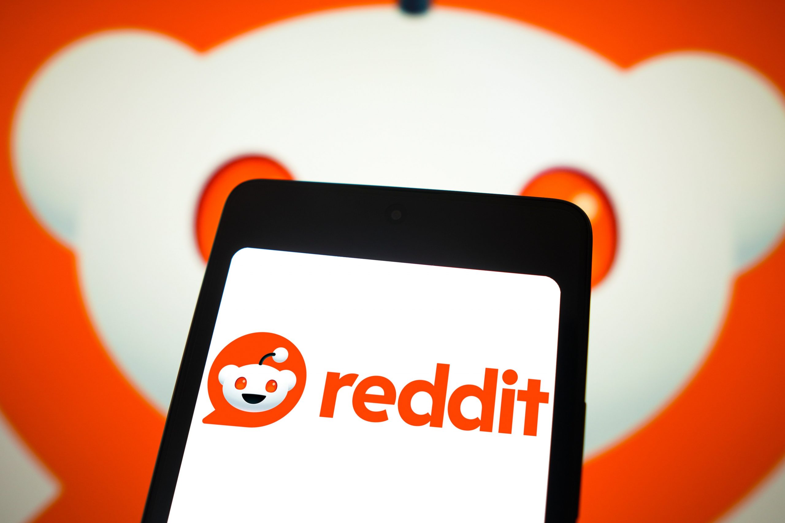 Reddit logo on phone