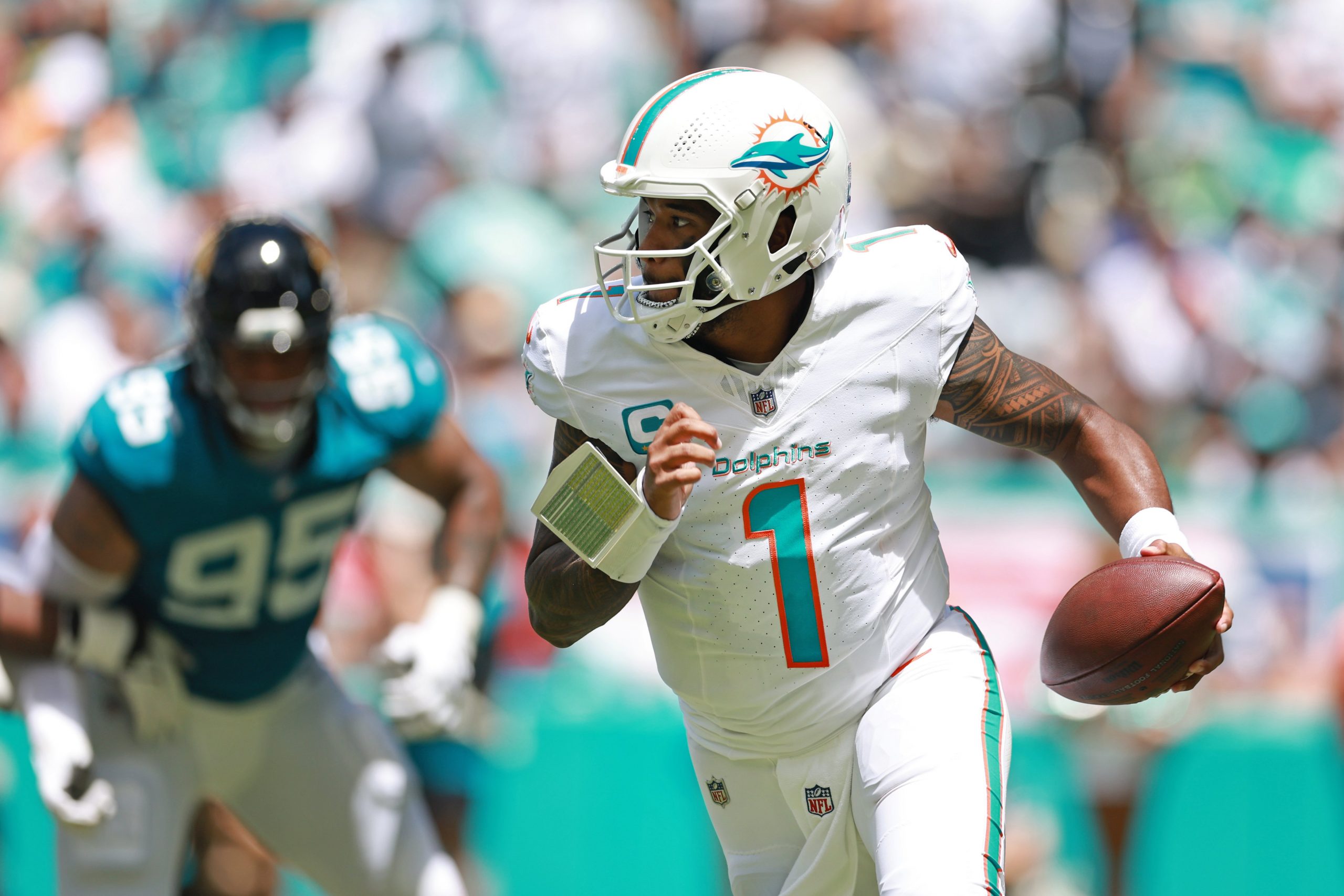 Tua Tagovailoa of the Miami Dolphins attempts a pass