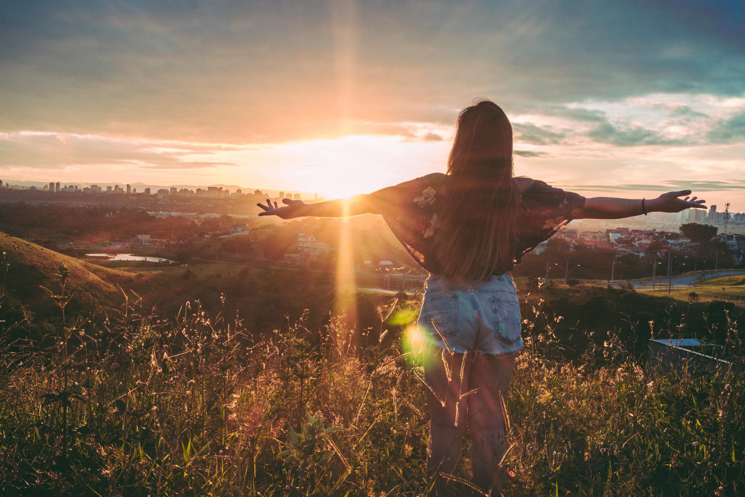 Women staring into sunset