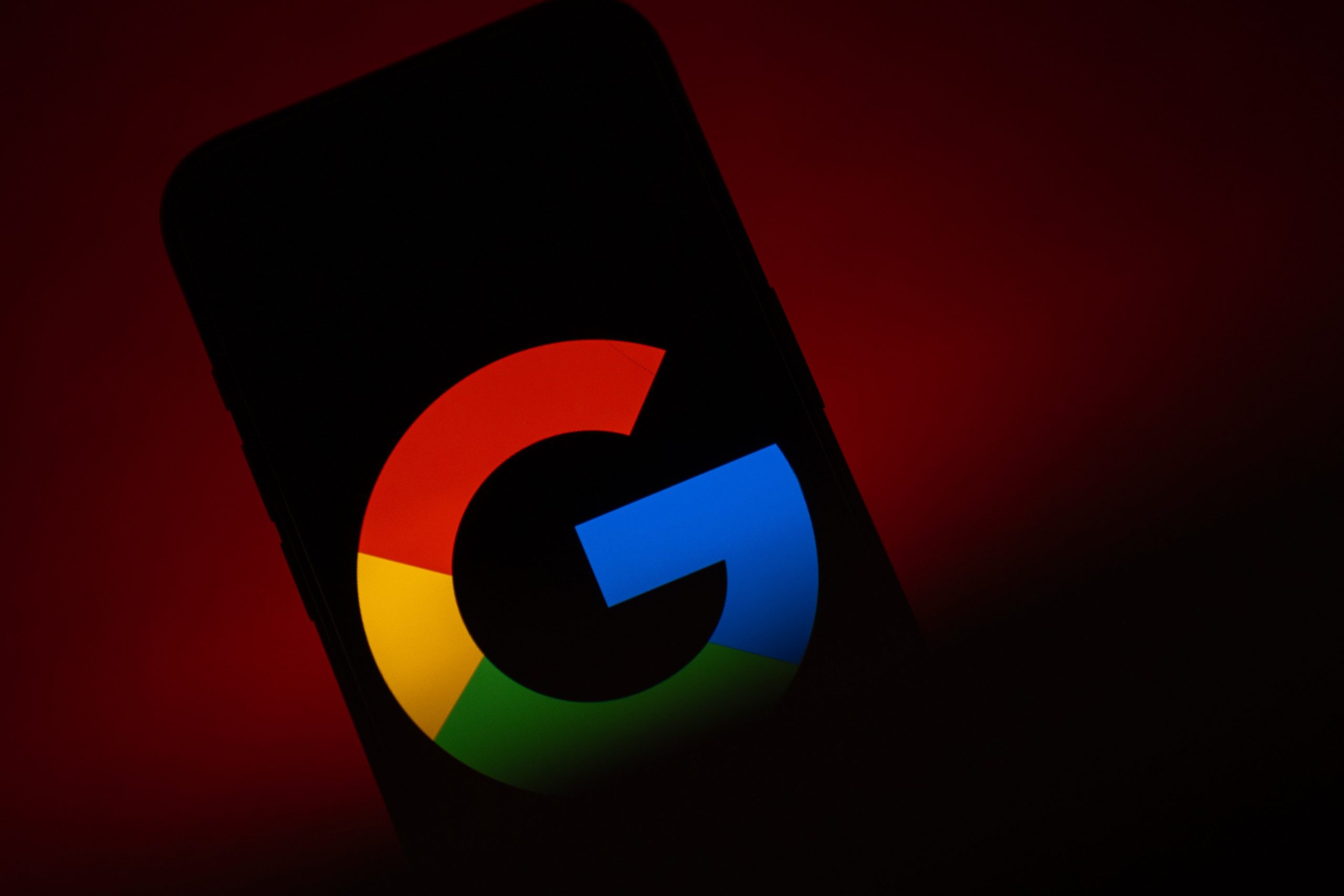 The Google logo on an ominously dark phone screen.