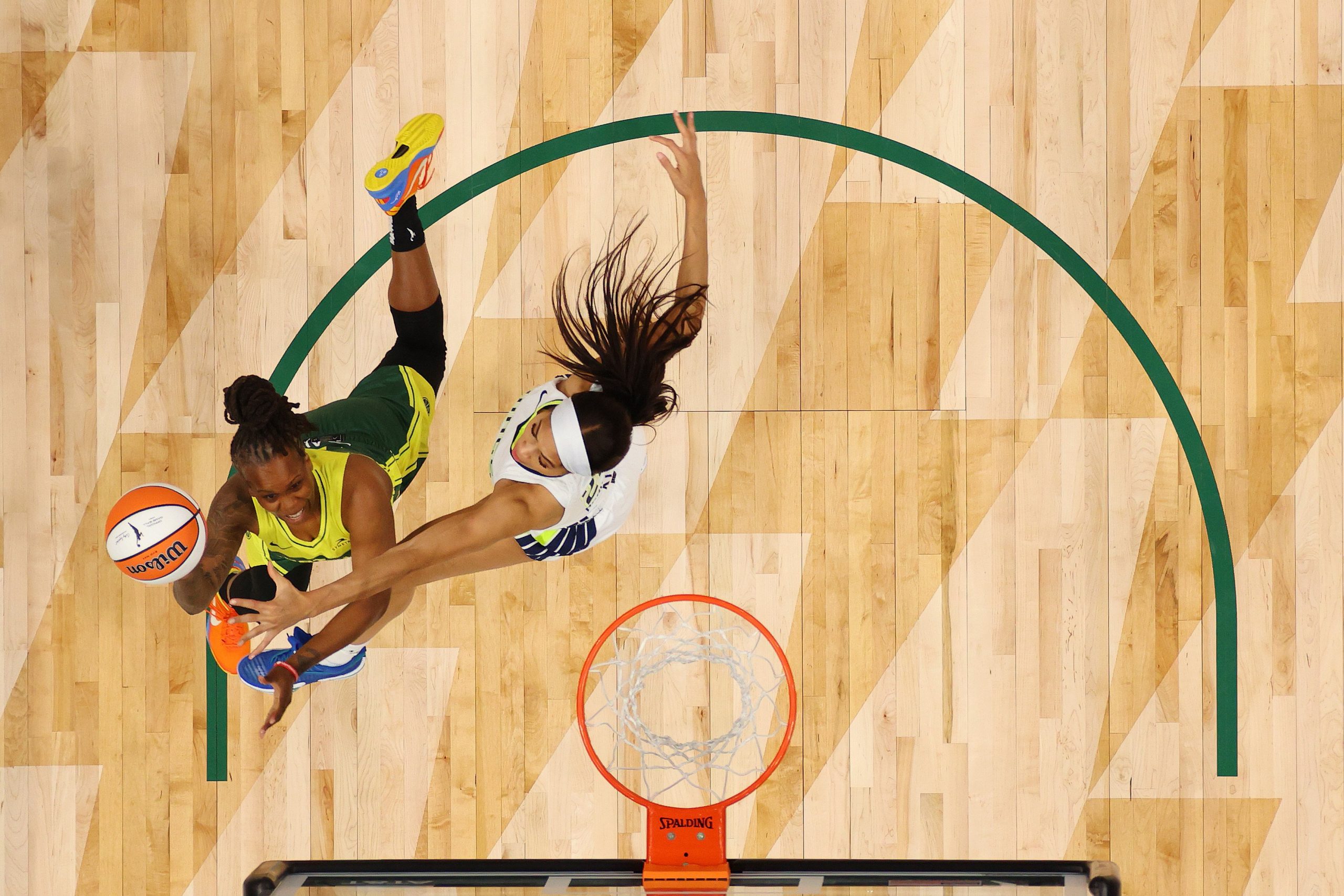 Epiphanny Prince of the Seattle Storm attempts a shot against Isabelle Harrison of the Dallas Wings