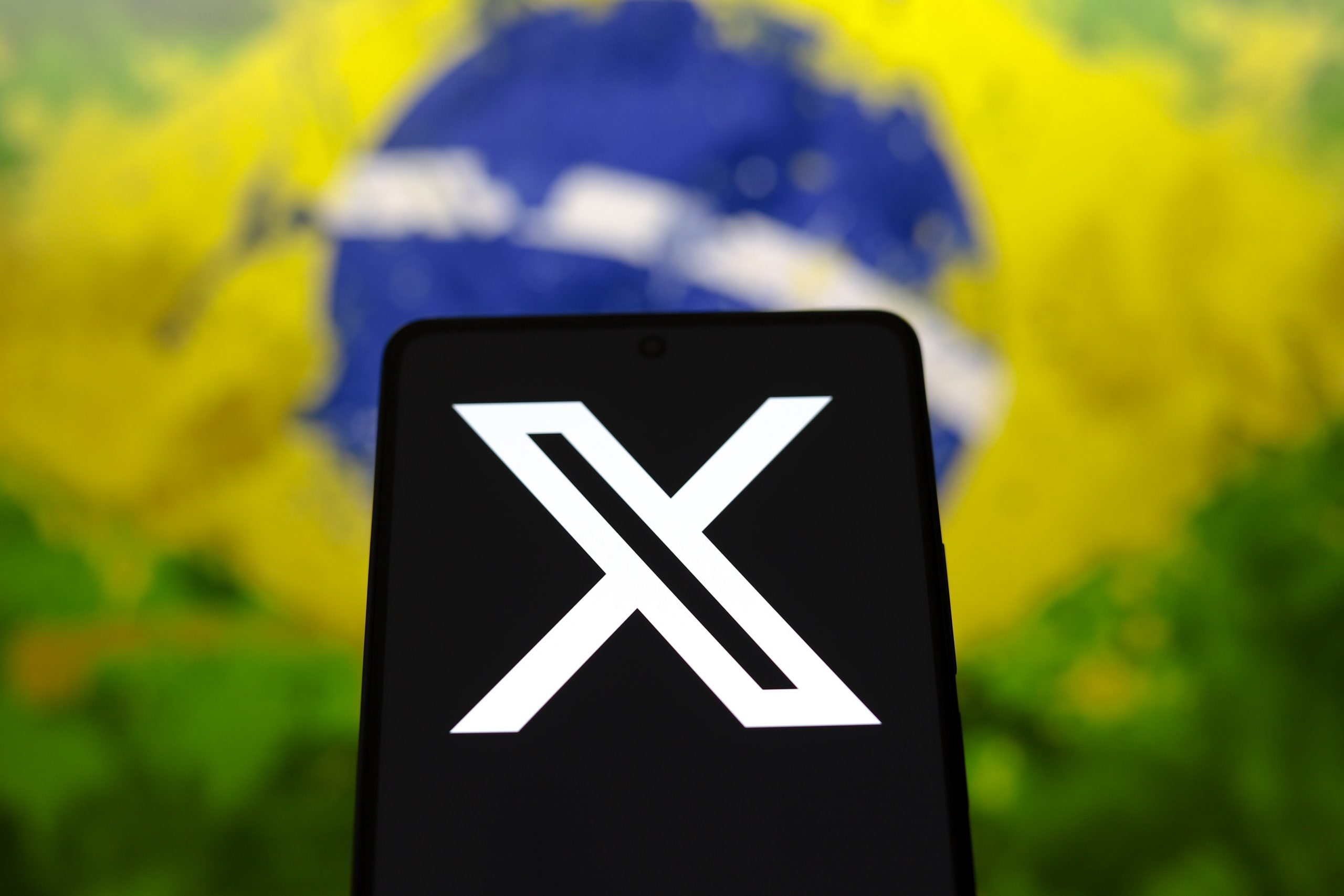 X logo with Brazil flag in the background