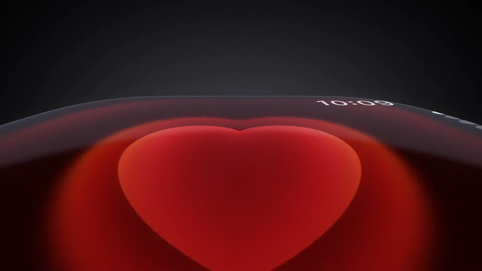 A zoomed in shot of a beating cartoon heart on an Apple Watch screen. 