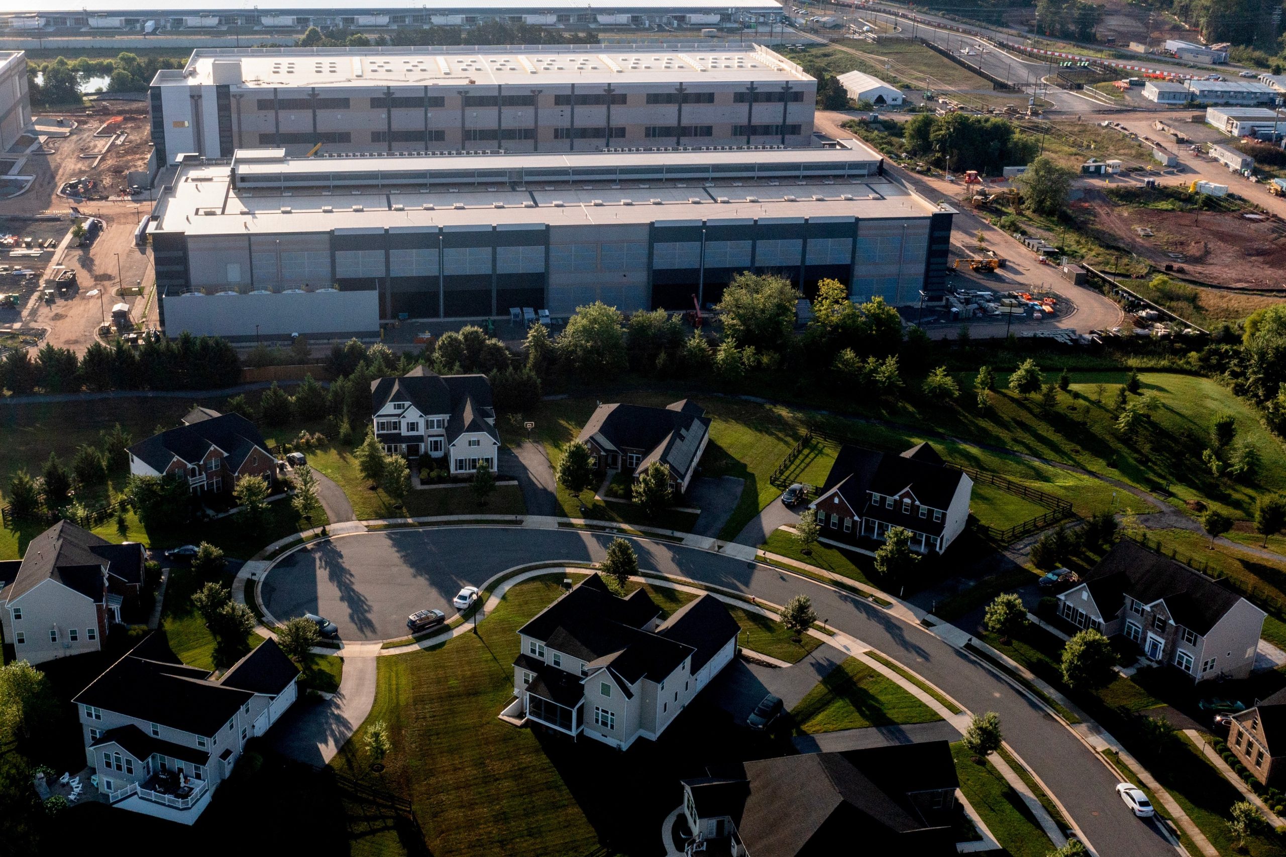 An aerial shot of an Amazon data center, right next to a residential neighborhood. 