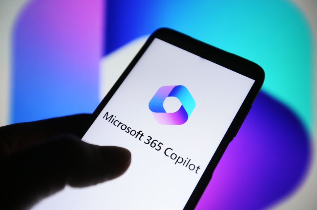 Microsoft 365 Copilot logo is seen on a smartphone screen.