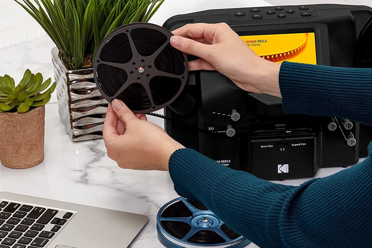 person using Kodak Reels film digitizer