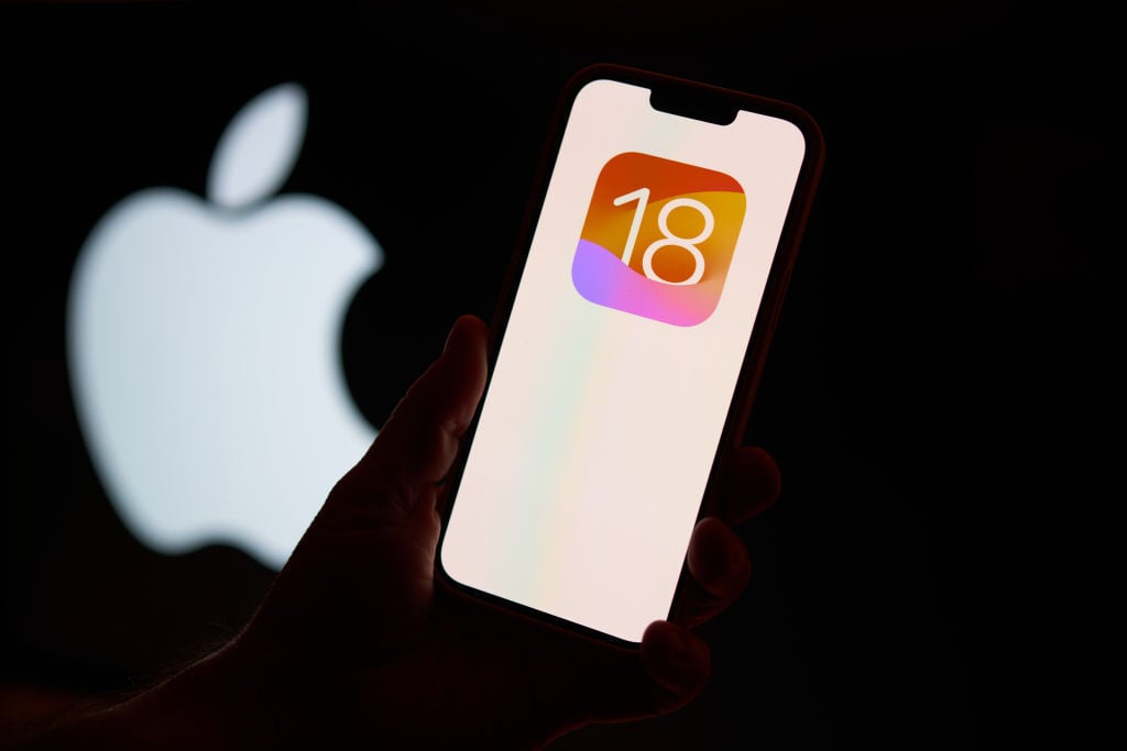 iOS 18 logo on phone screen