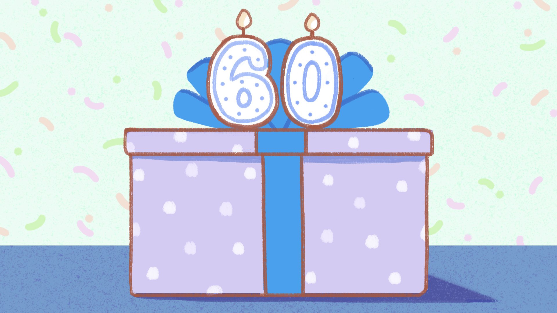 gift-shaped cake with 60 on top