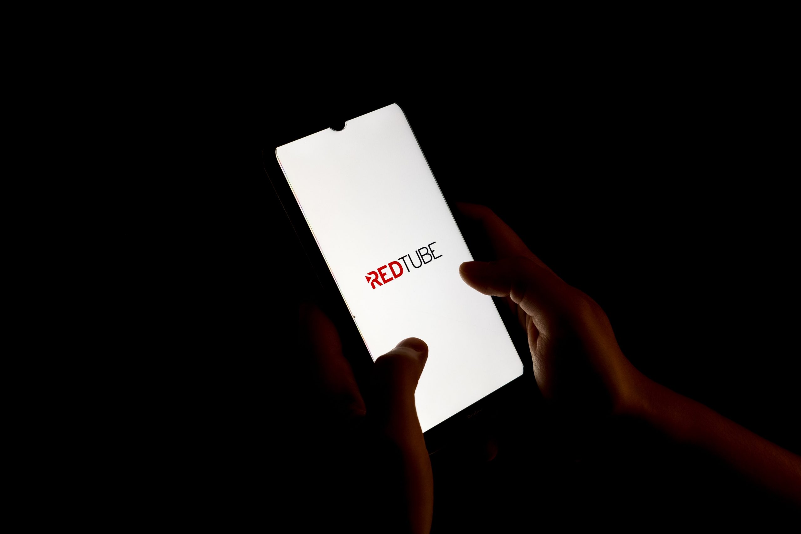 In this photo illustration a Redtube logo seen displayed on a smartphone screen