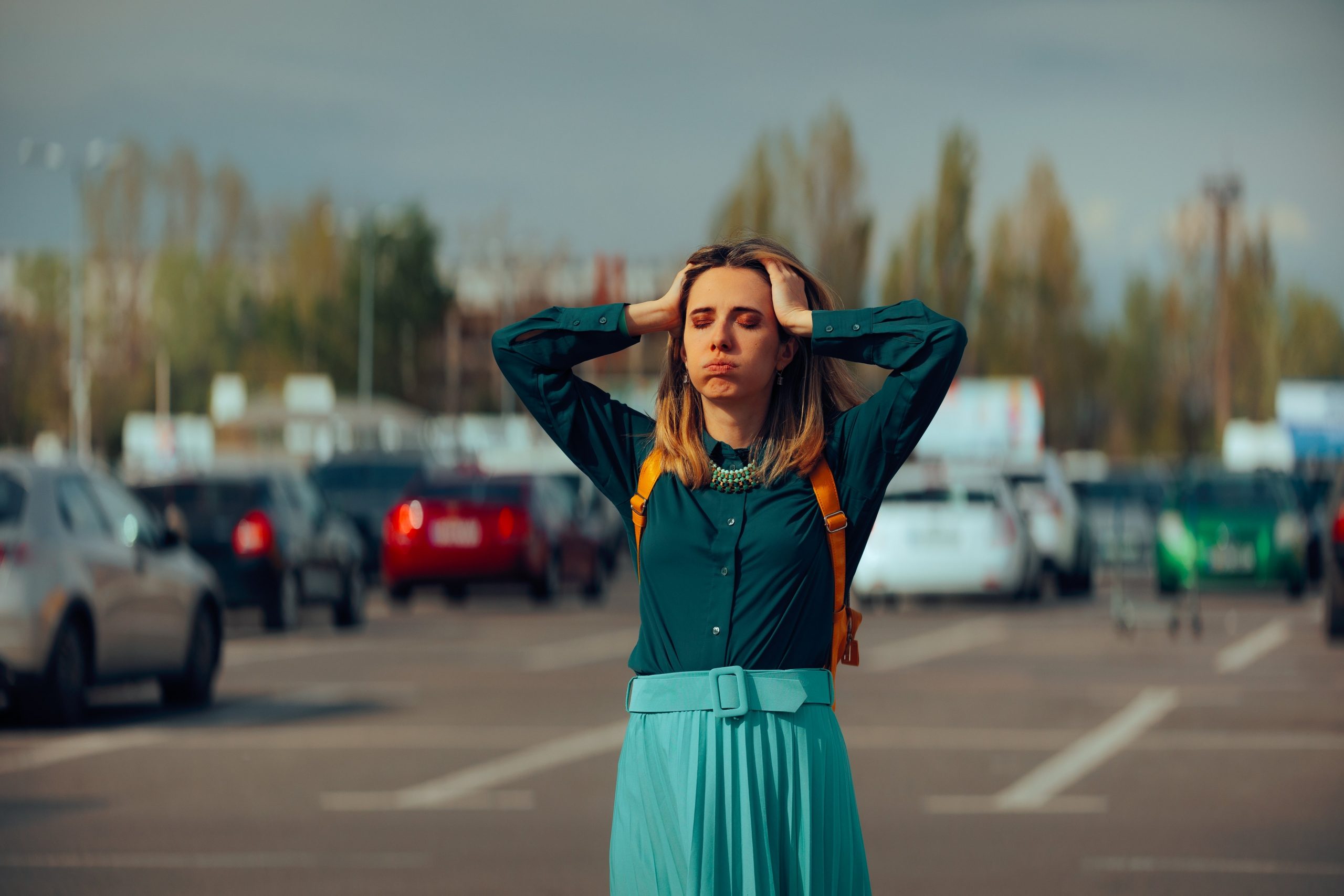 Woman looking frustrated inside a parking lot