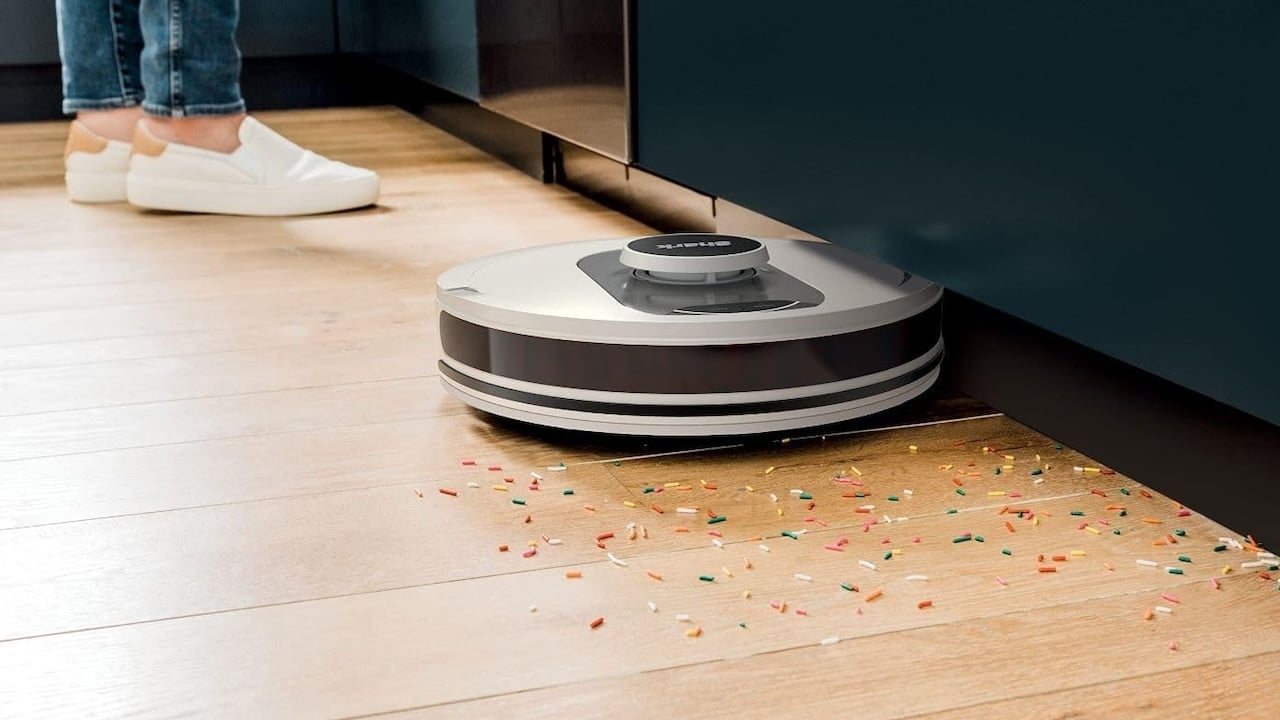 Shark AI Ultra robot vacuum cleaning up in a kitchen