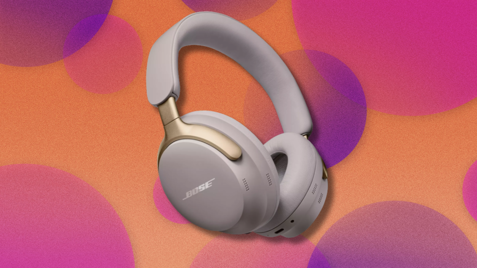 Bose QuietComfort Ultra headphones on orange and pink abstract background 