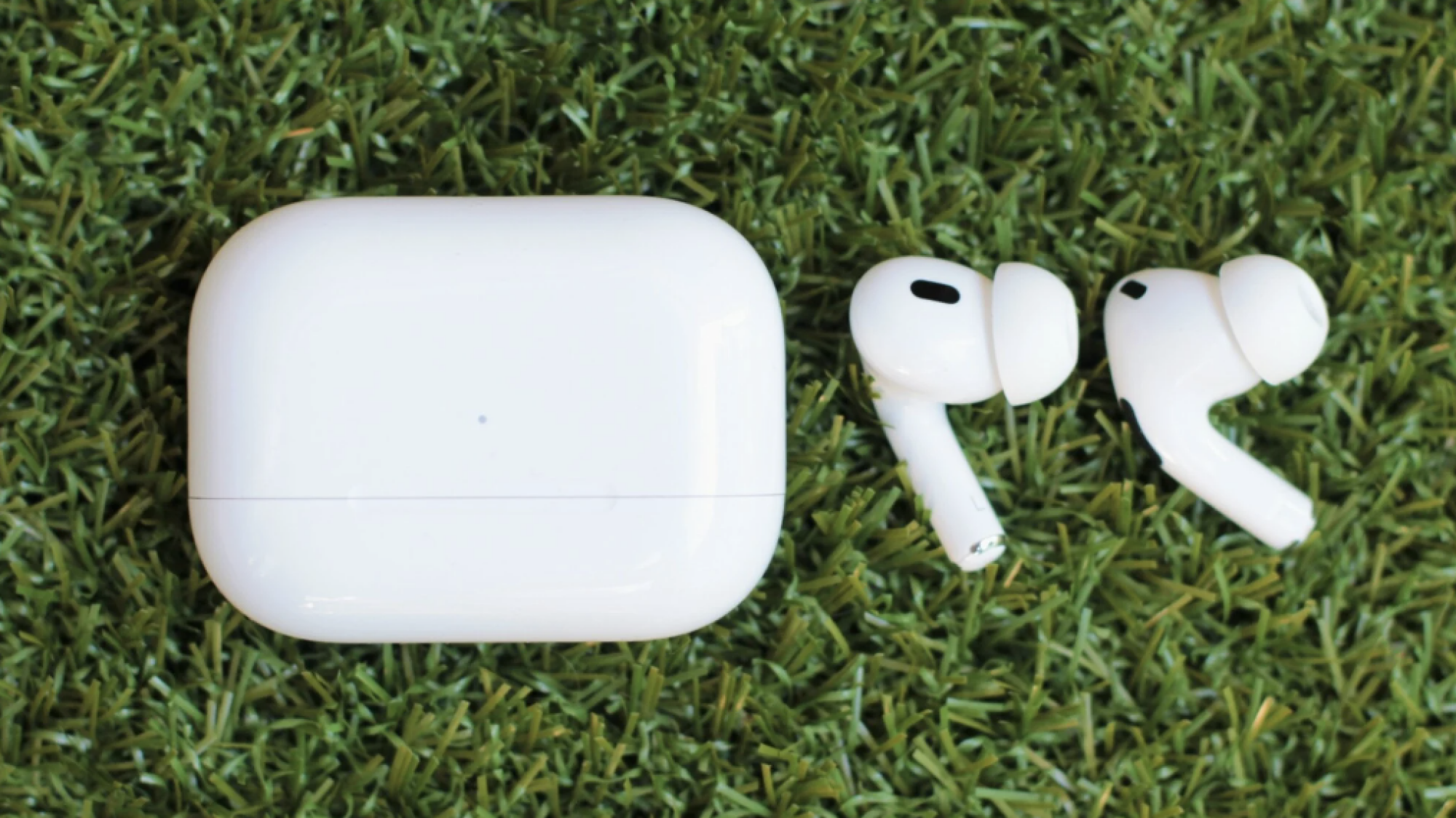 Airpods laying on grass