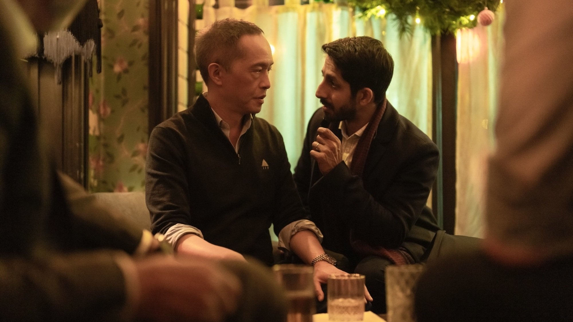 Rishi and Eric have a discussion at a pub.