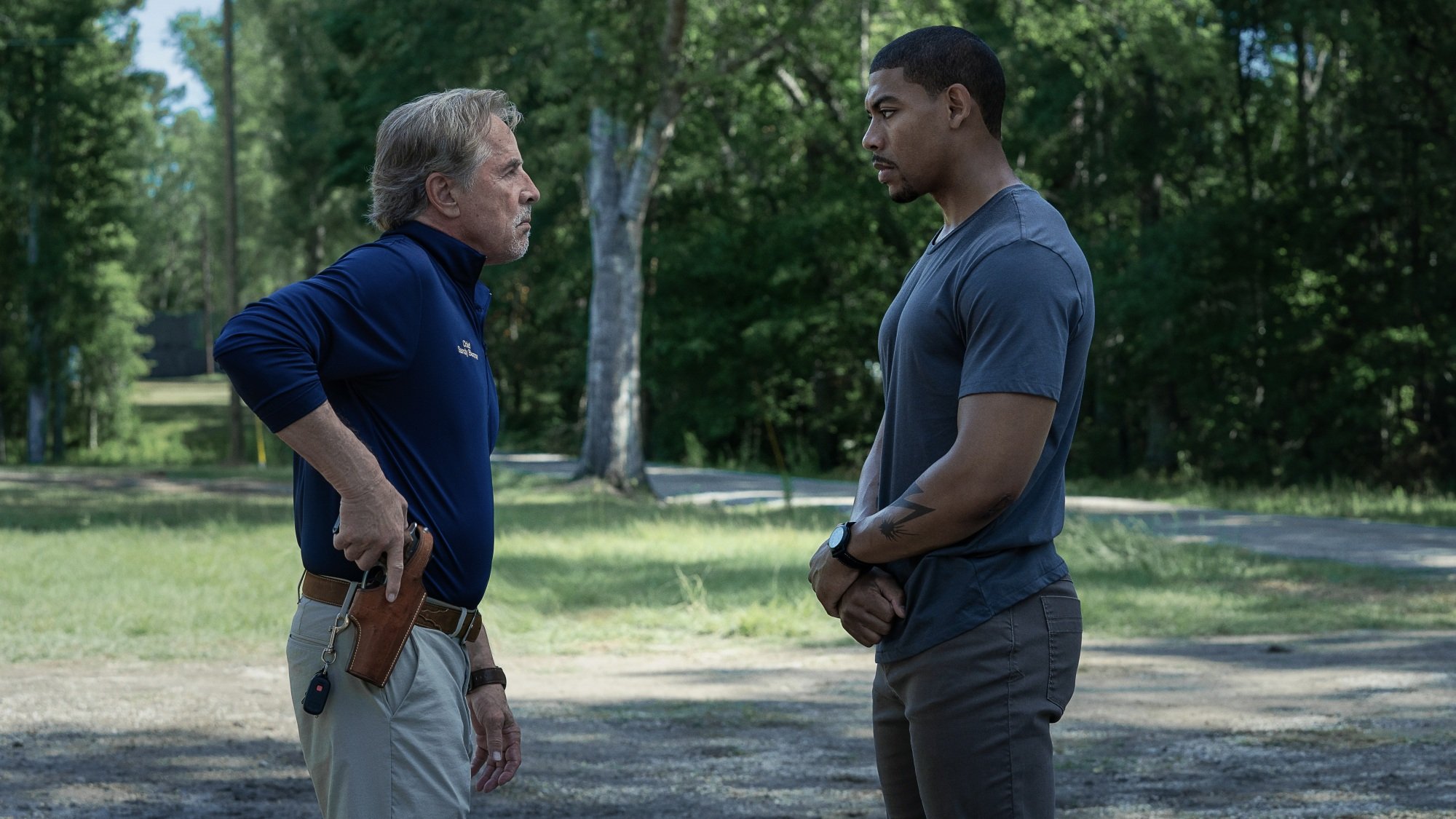 Police chief Sandy Burnne and Terry Richmond have a tense standoff outside a police station.