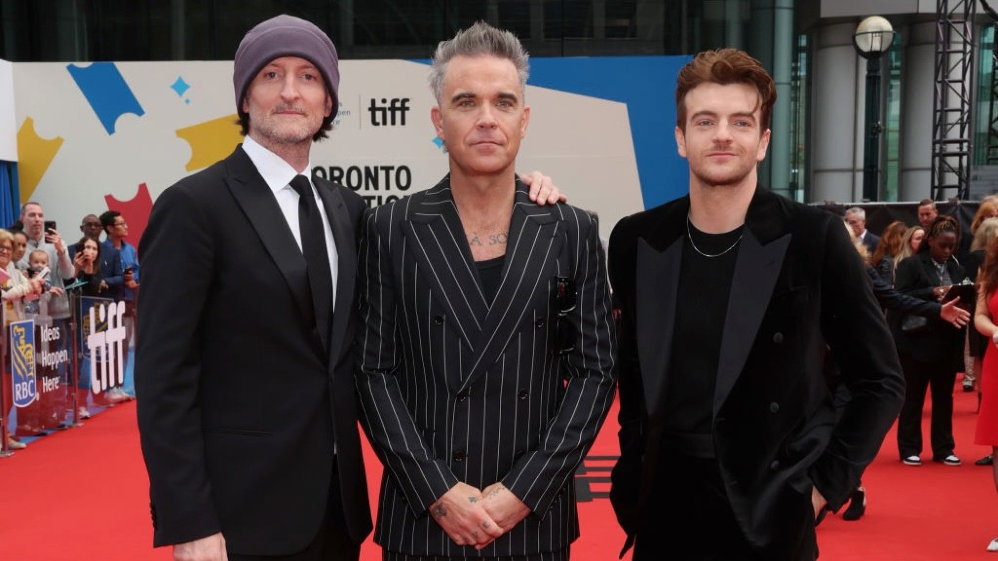 Michael Gracey, Robbie Williams, and Jonno Davies attend the "Better Man" Canadian Premiere at the Toronto International Film Festival.