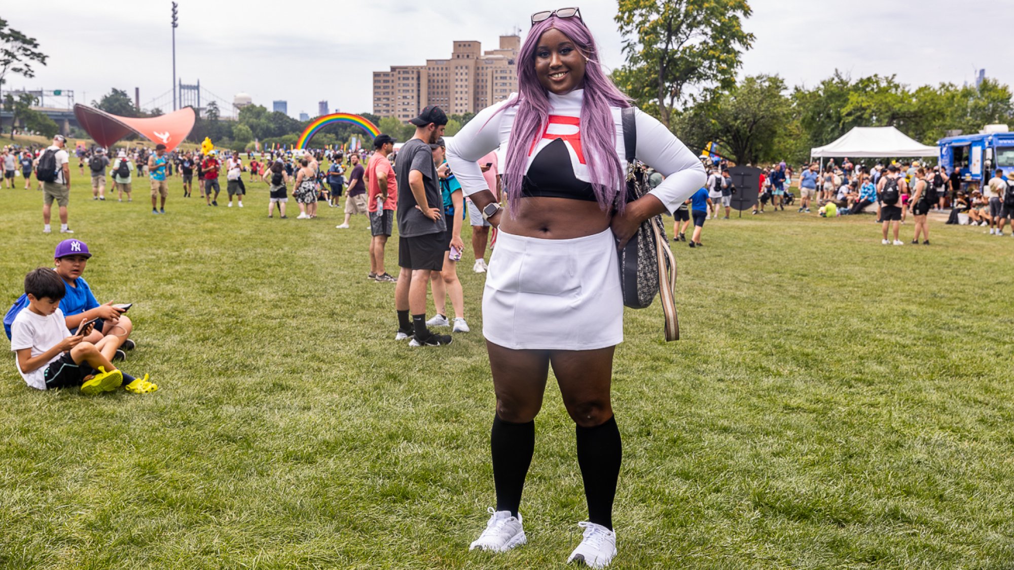 A Black woman cosplaying as a member of Team Rocket.