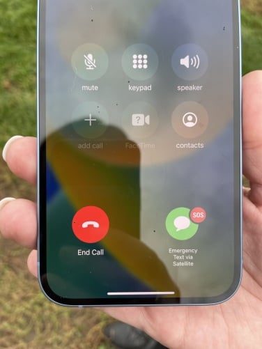 close up of emergency sos via satellite activation on an iphone 14