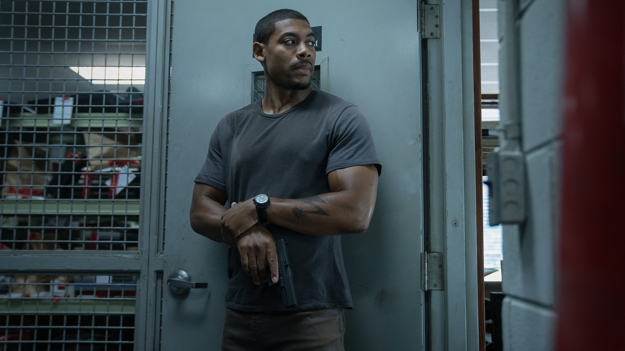 Terry Richmond holds a gun in a police station evidence locker.