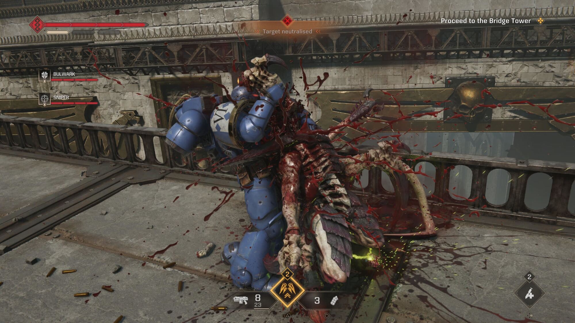 A Space Marine from the Ultramarines chapter in blue armor is executing a gory melee attack against an enemy, with blood splattering across the scene. The HUD shows weapon icons and a health bar, indicating in-game action.