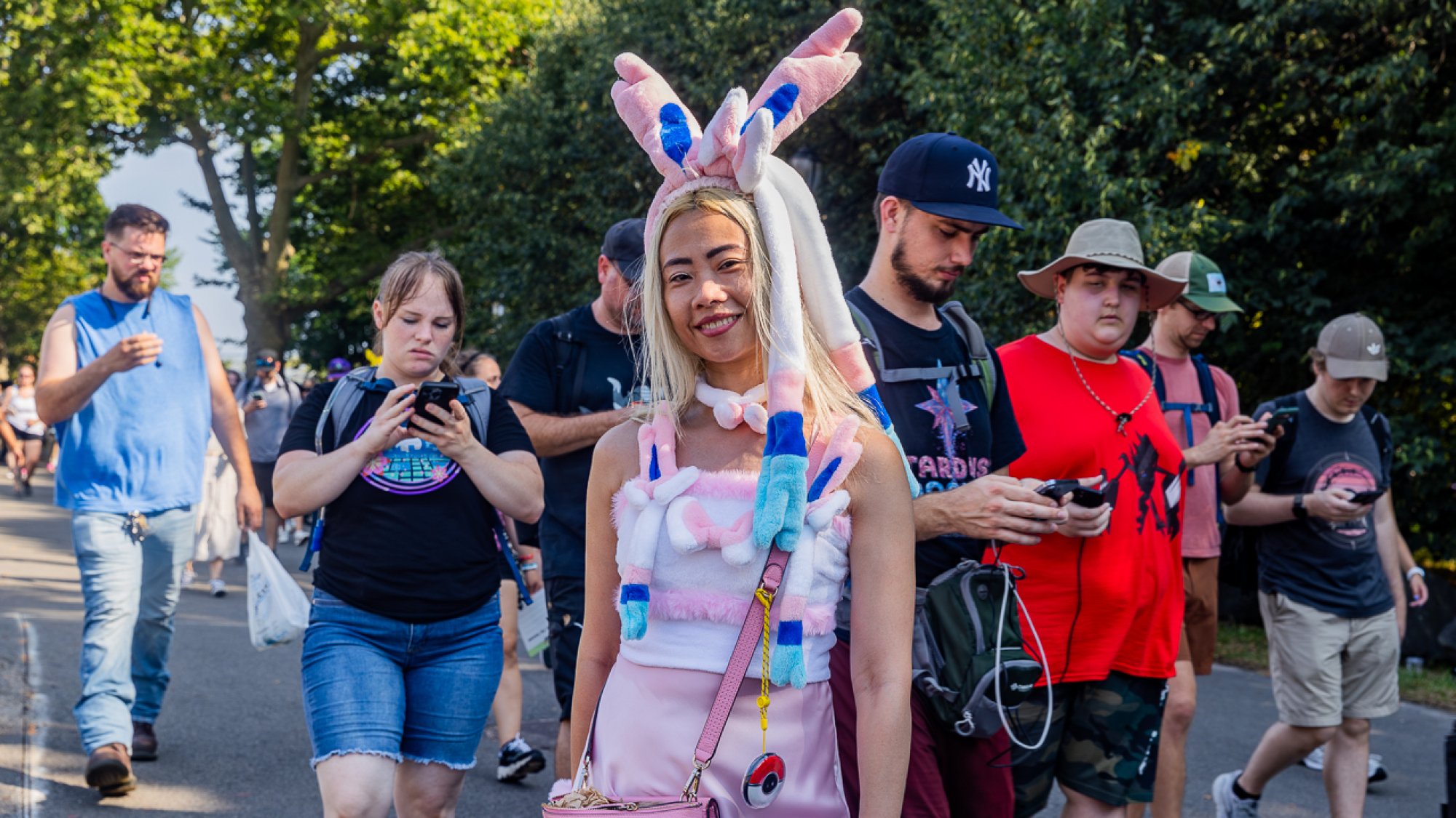 A woman cosplaying as Eeveelution Sylveon.