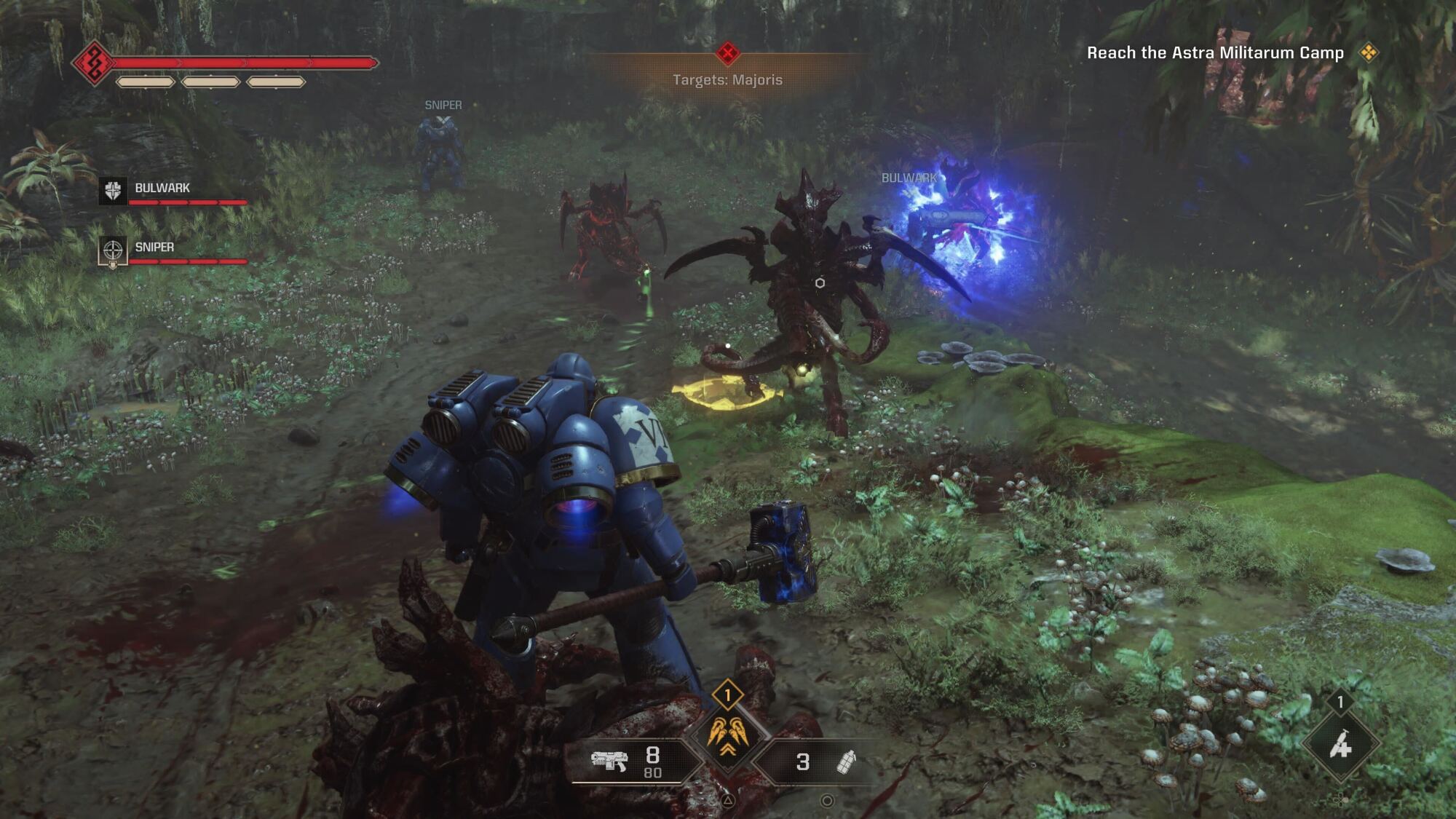 The Space Marine is engaging Tyranid enemies in a dense, overgrown battlefield. There are large alien creatures attacking, and the player's HUD indicates the intensity of the encounter with a hammer in hand, ready to fight.