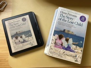 kobo e-reader next to book