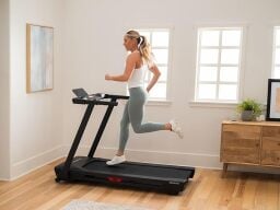 woman running on treadmill