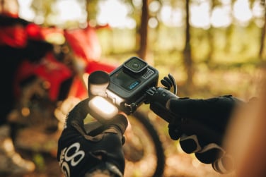 cyclist using gopro hero13 black with creator attachments