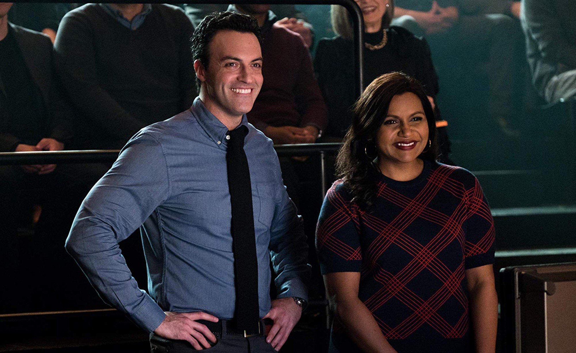 Reid Scott and Mindy Kaling laughing in a still from "Late Night."