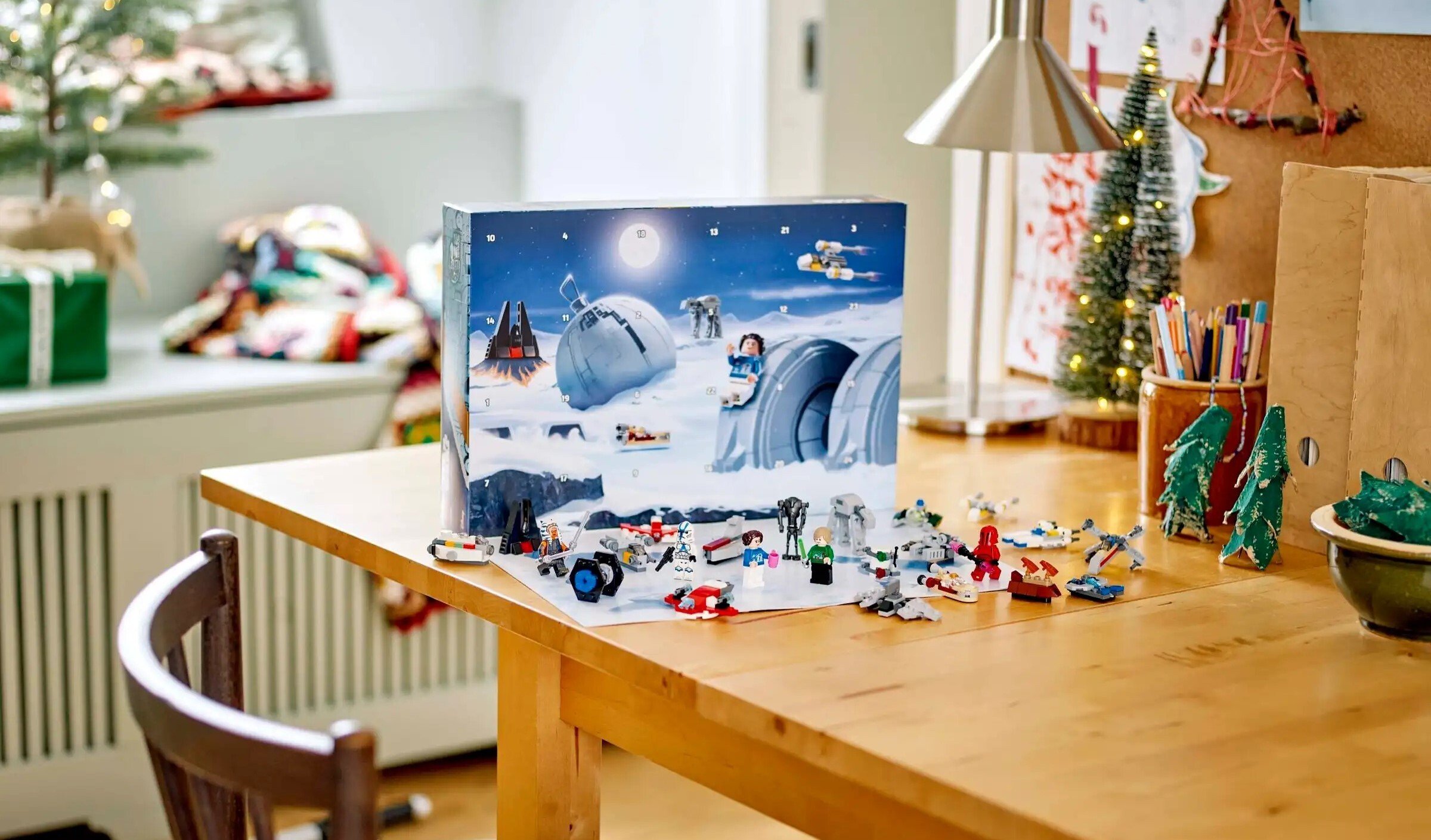 a star wars lego advent calendar sits on a table with holiday decorations