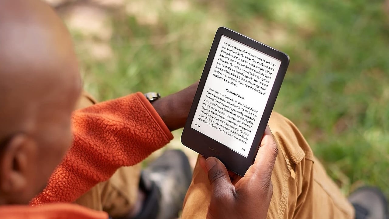 Person reading a Kindle er-eader tablet