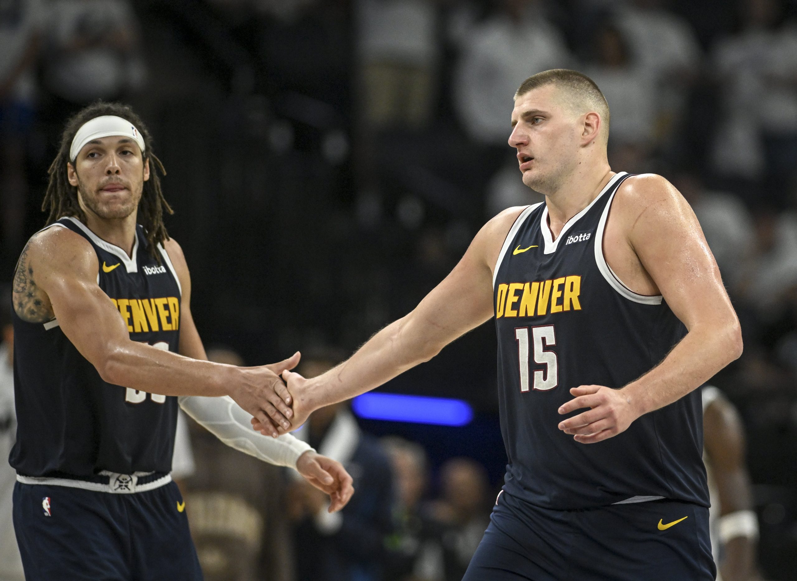 Nikola Jokic of the Denver Nuggets shakes hands