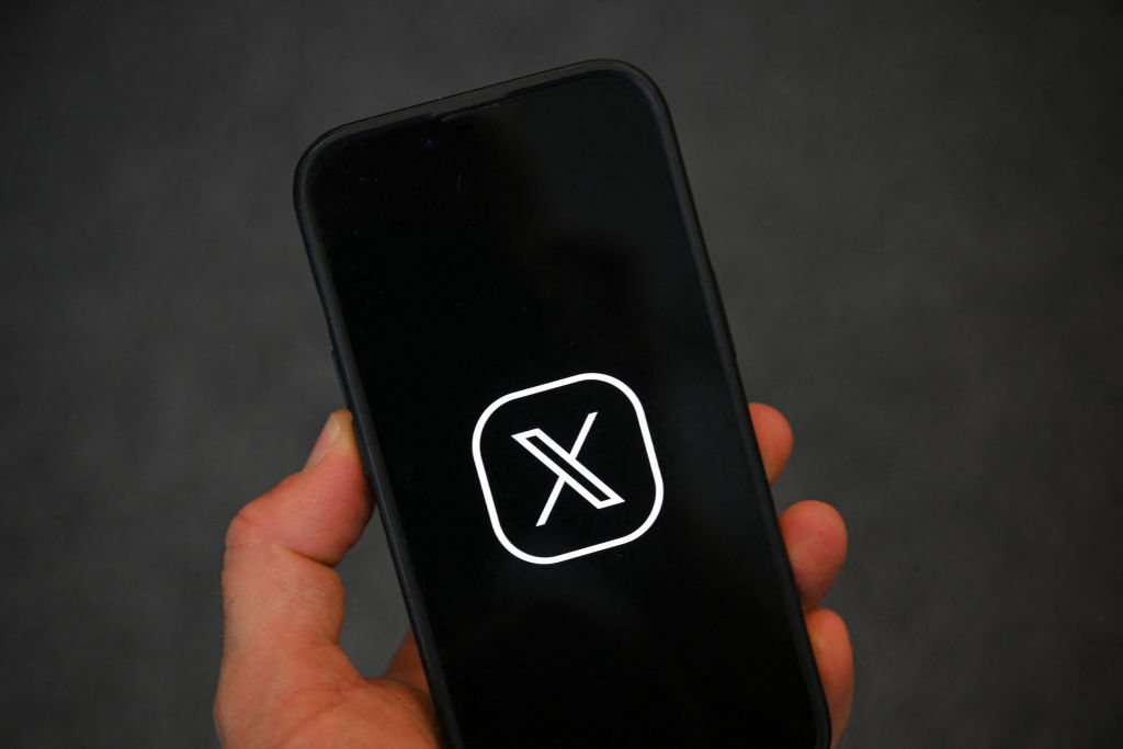 X logo on phone screen