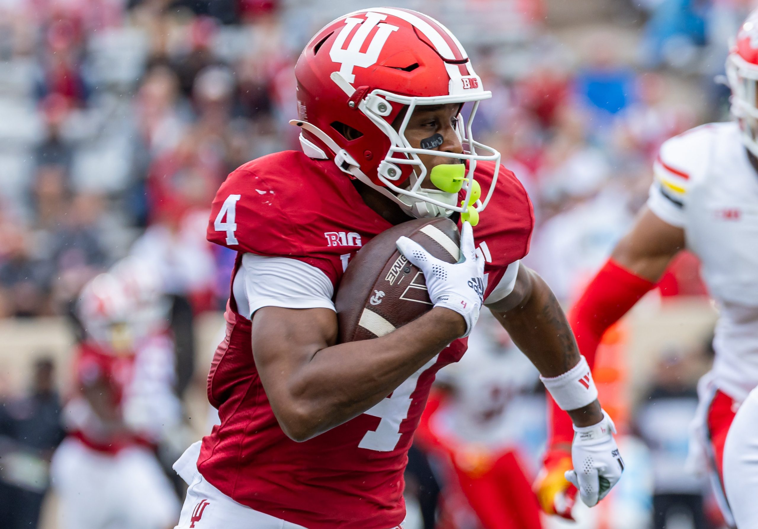 Myles Price #4 of the Indiana Hoosiers runs the ball during the game against the Maryland Terrapins at Memorial Stadium on Sept. 28, 2024, in Bloomington, Indiana.