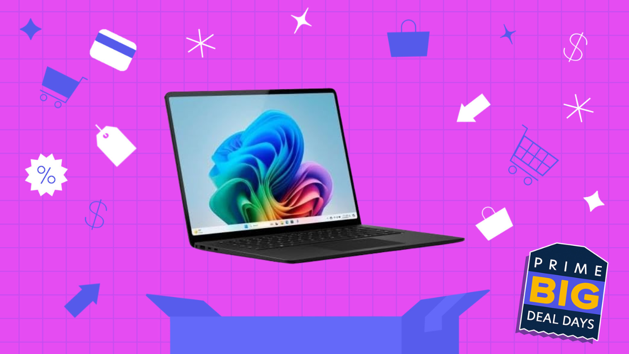 microsoft surface laptop on bright pink background