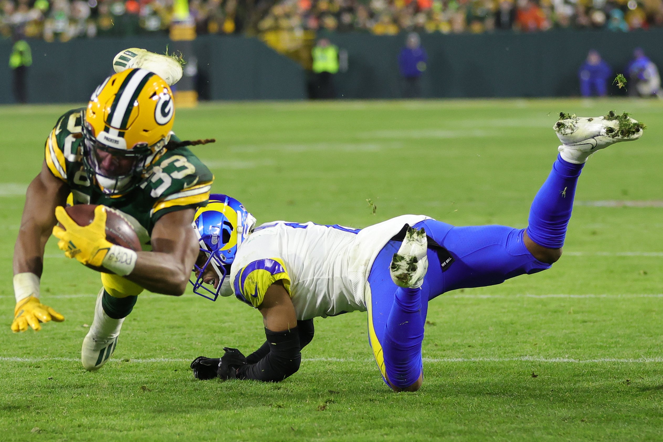 Aaron Jones of the Green Bay Packers avoids a tackle 