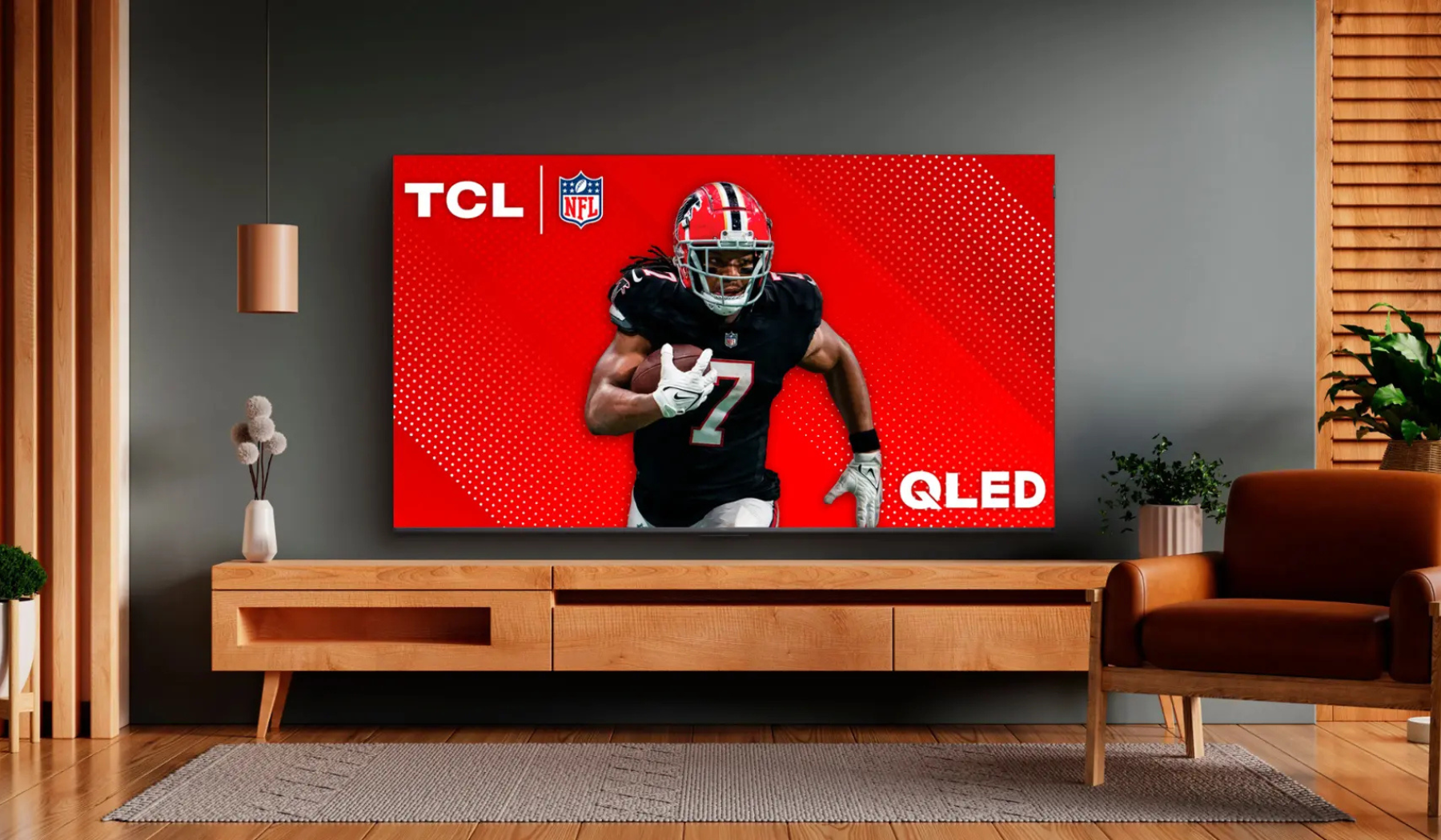 TCL QLED TV on blue wall in living room scene