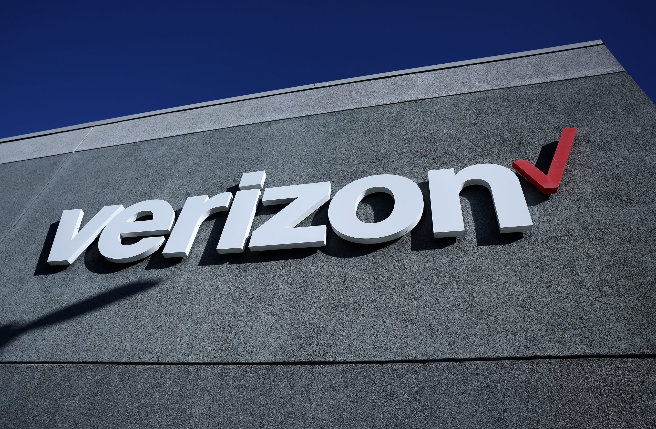 A sign is posted on the exterior of a Verizon store on September 30, 2024 in Daly City, California