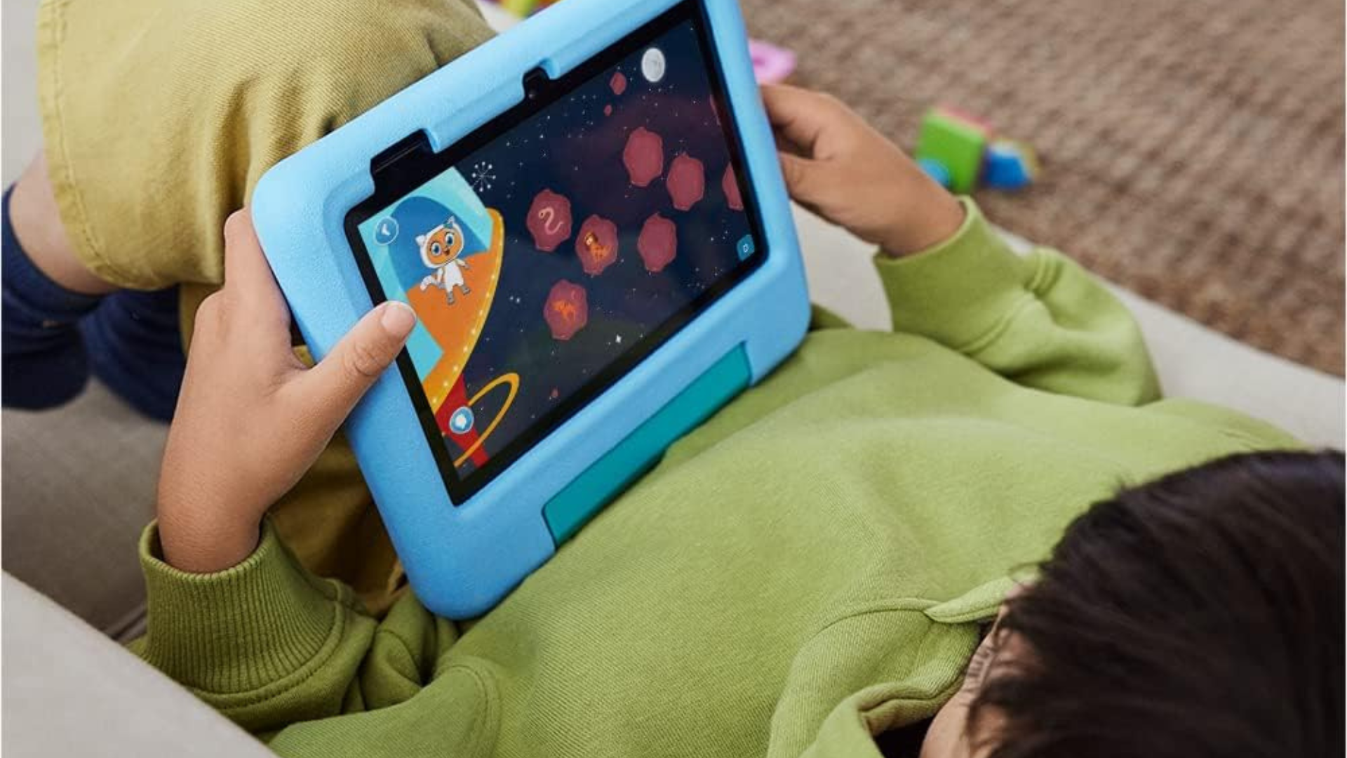 A child playing on an Amazon Fire 7 Kids tablet