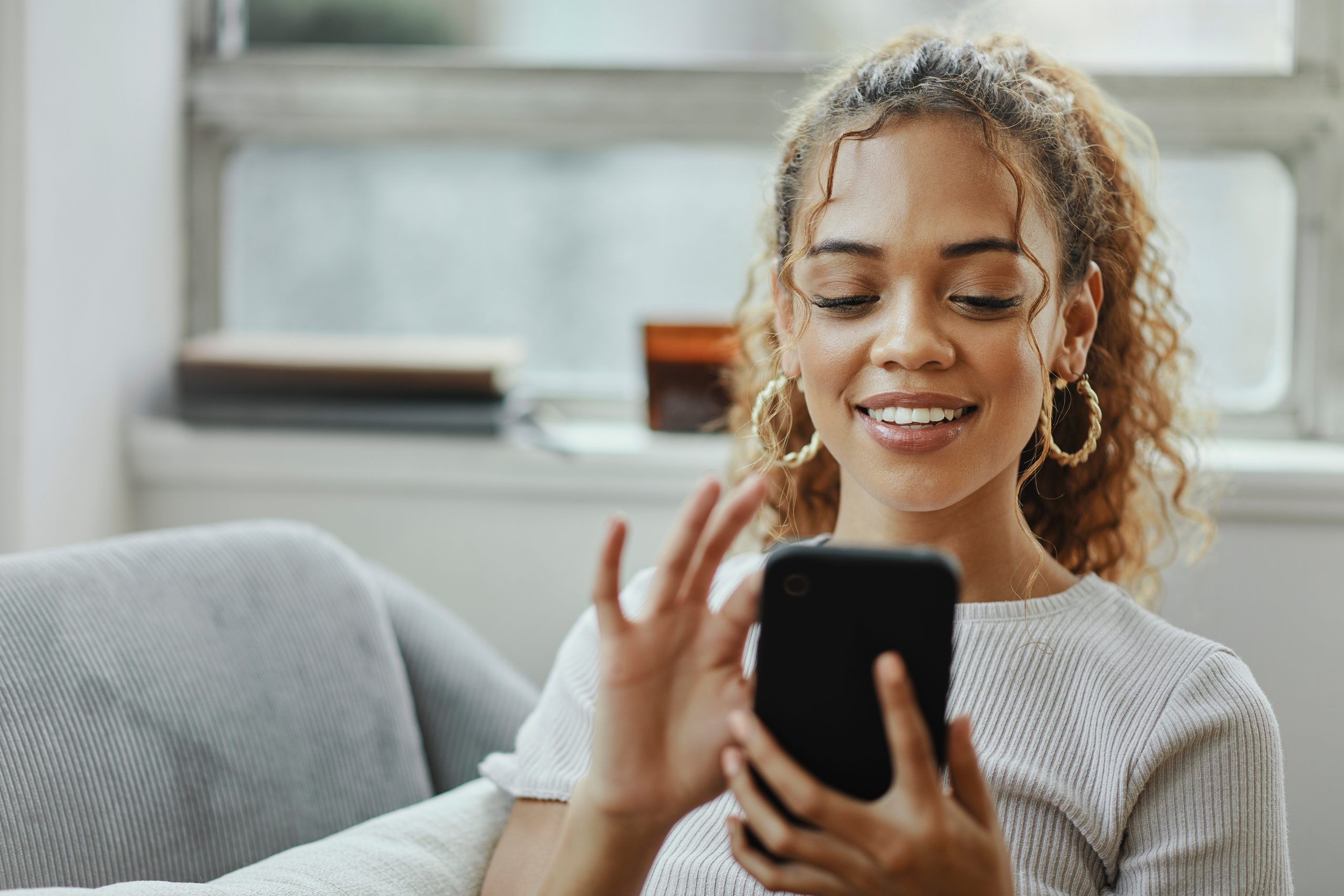 woman reading on her phone