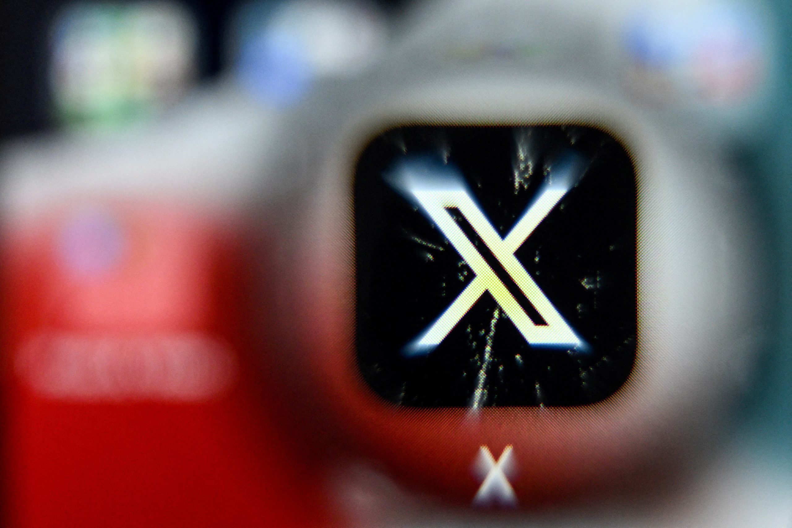 x logo blurred on a smartphone