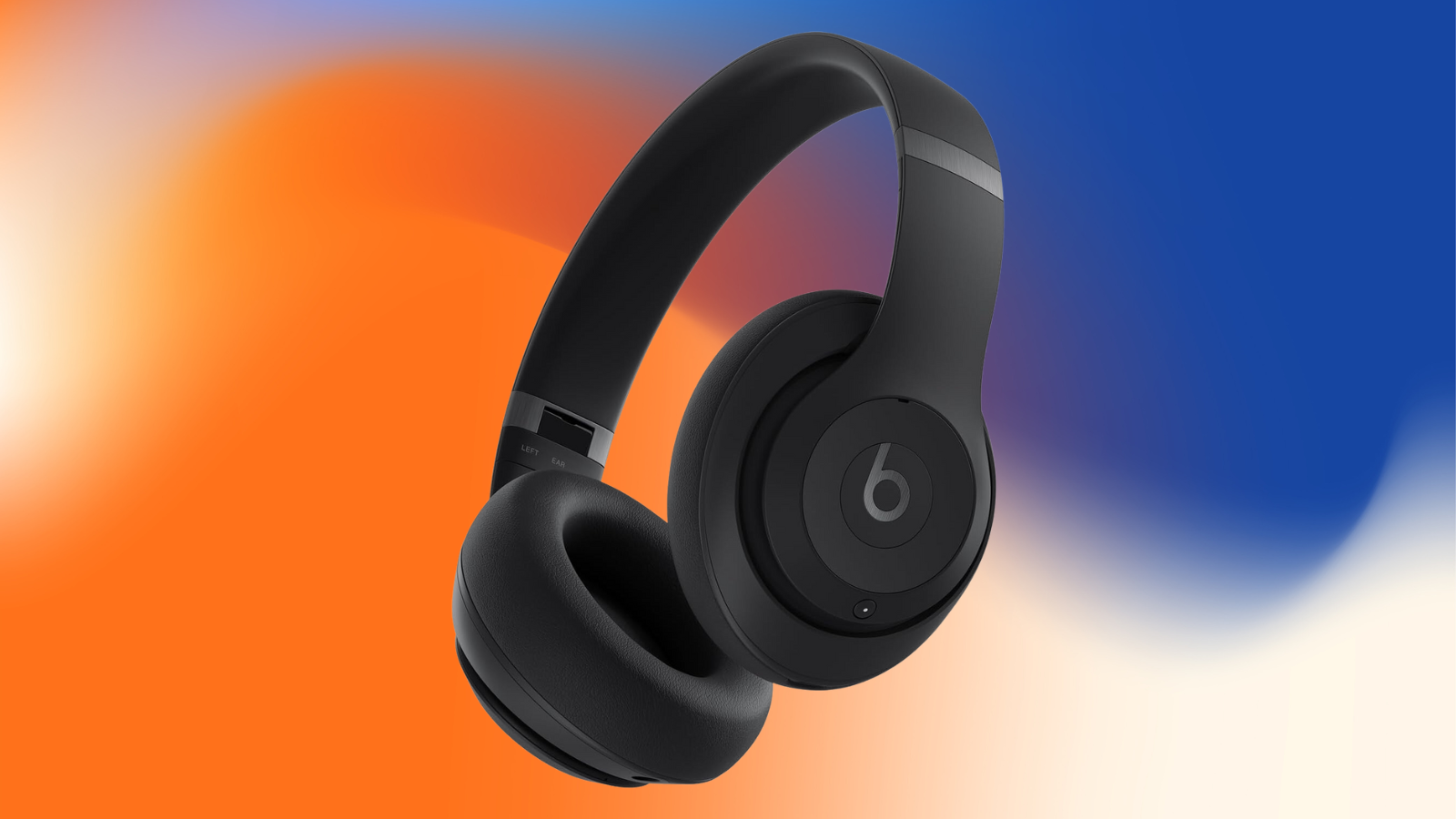 Beats Studio Pro on an orange, white and blue watercolor background