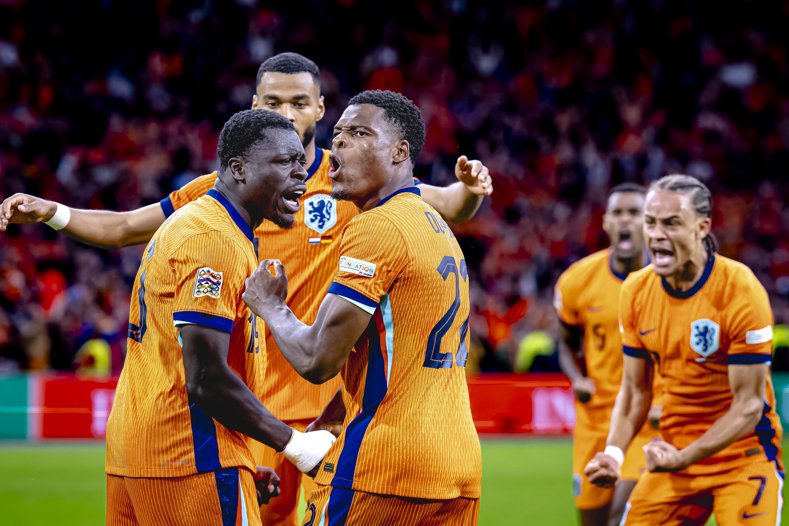 Netherlands forward Brian Brobbey and Netherlands defender Denzel Dumfries celebrate