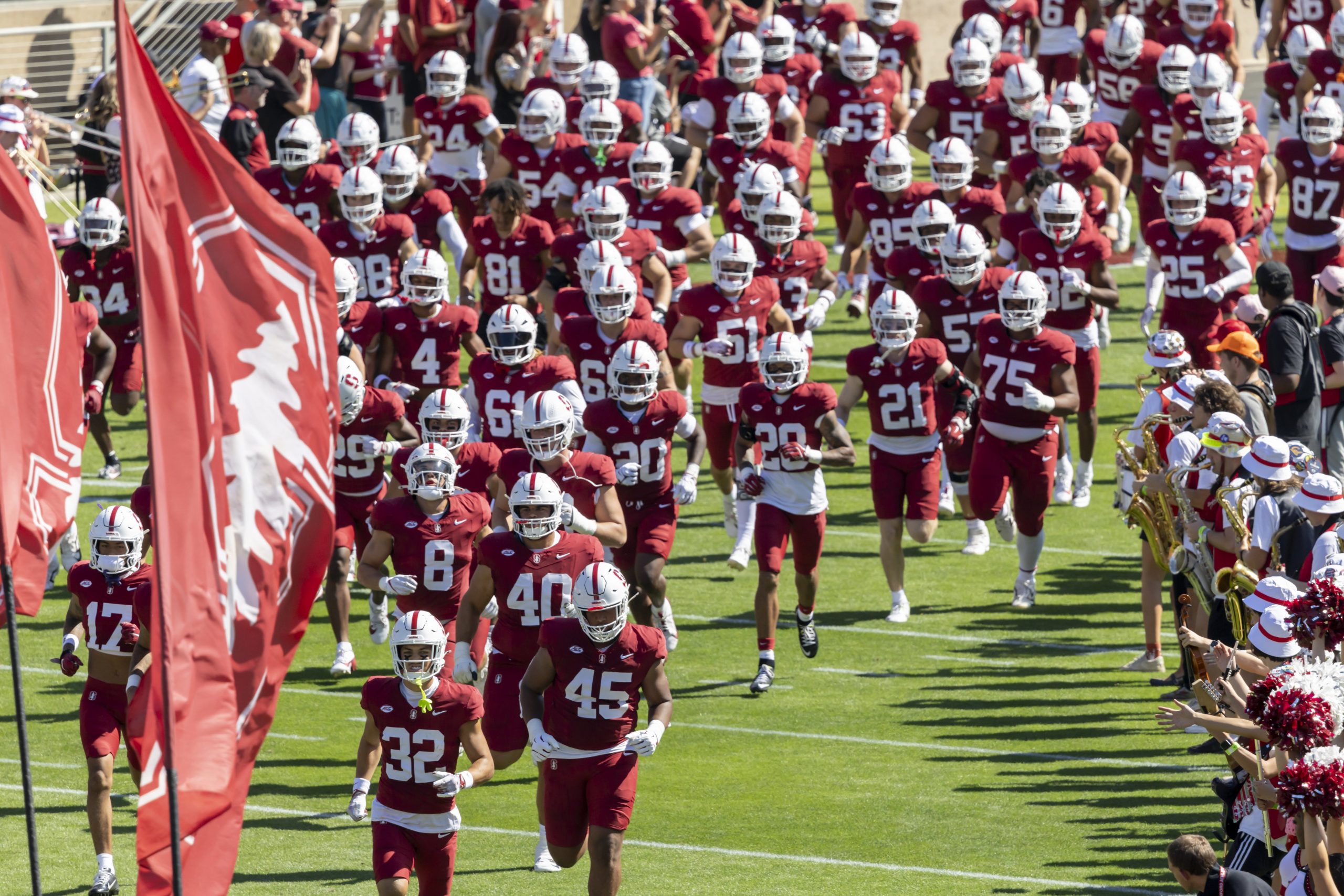 Stanford Cardinal football team runs onto the field