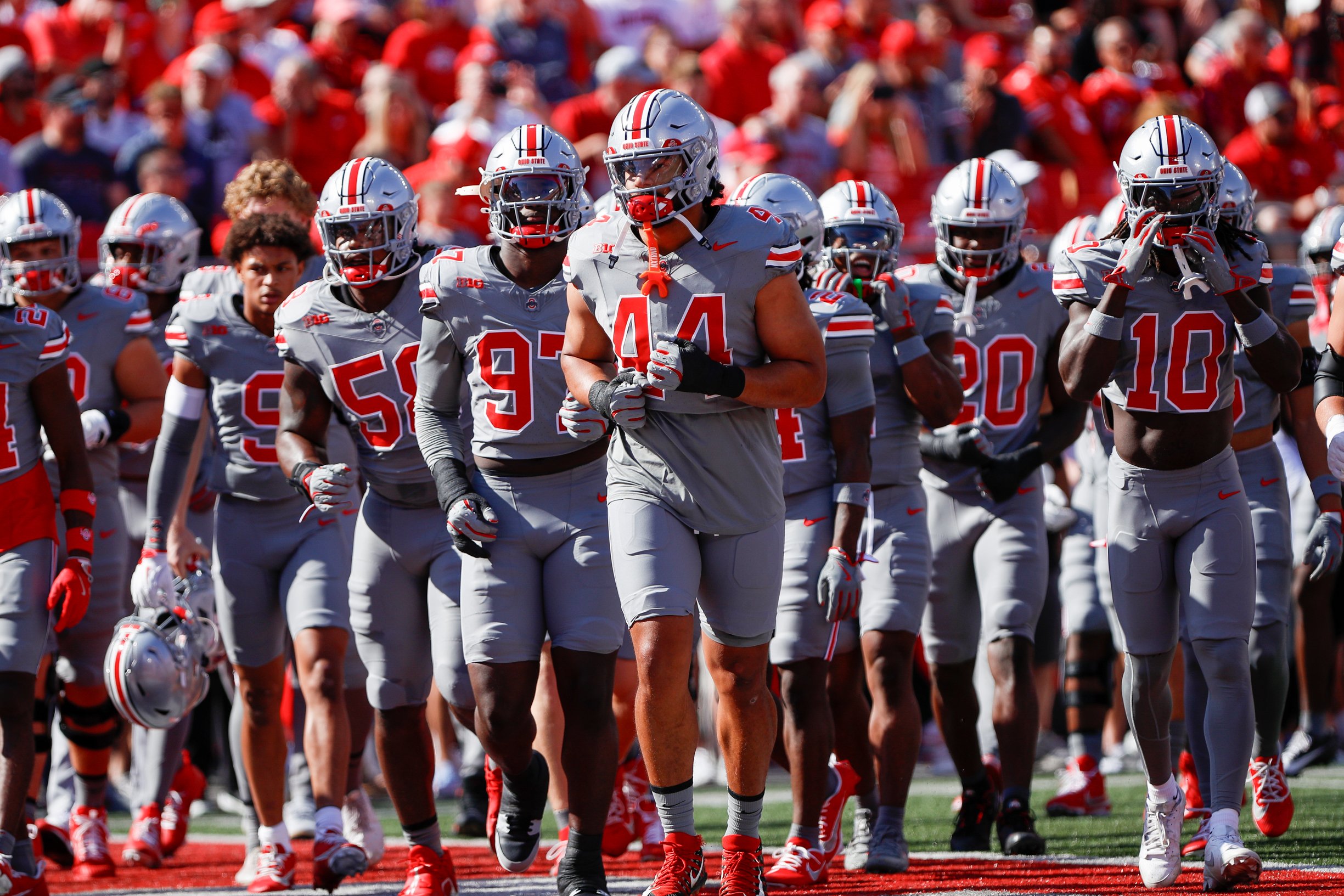 Ohio State Buckeyes players run off the field 