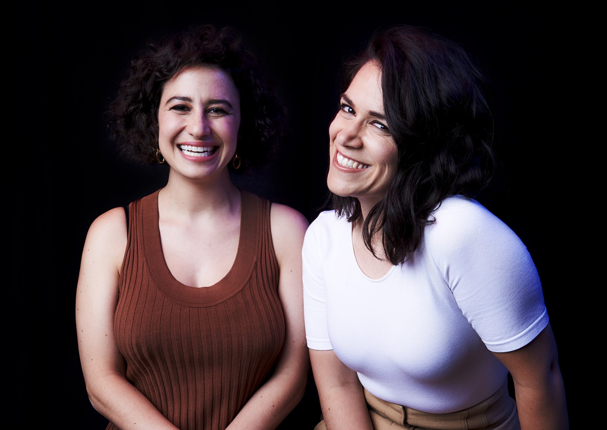 Abbi Jacobson and Ilana Glazer smiling in a portrait. 