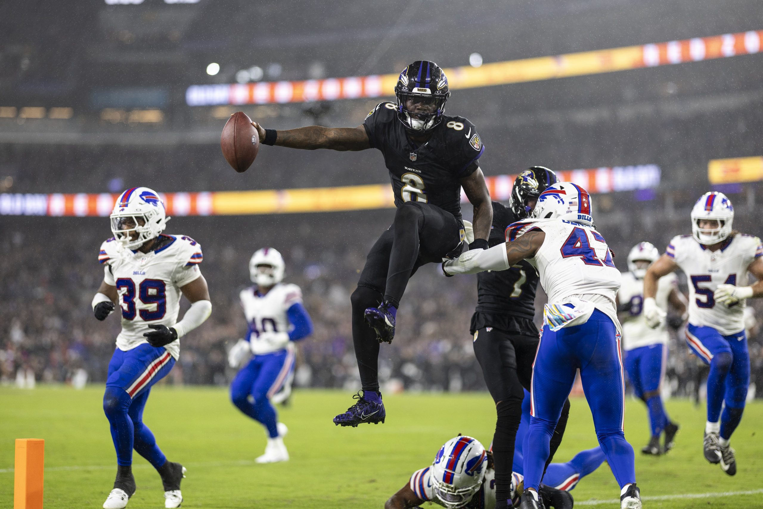 Lamar Jackson of the Baltimore Ravens jumps into the end zone