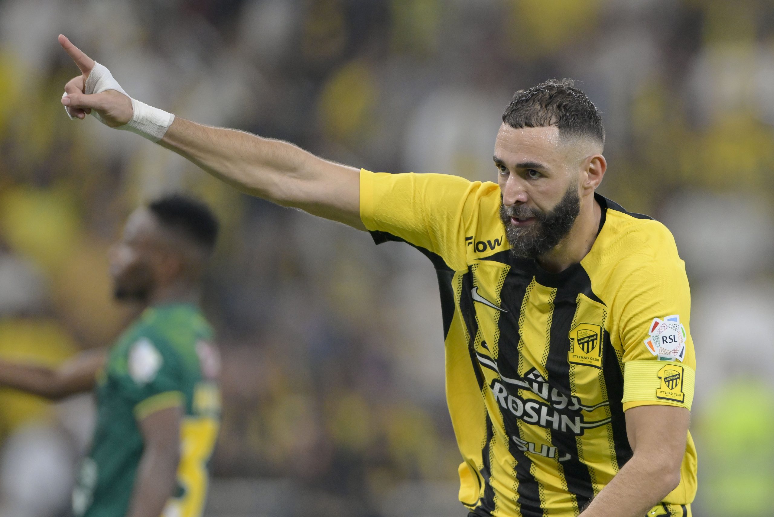 Karim Benzema of Al Ittihad directs his team