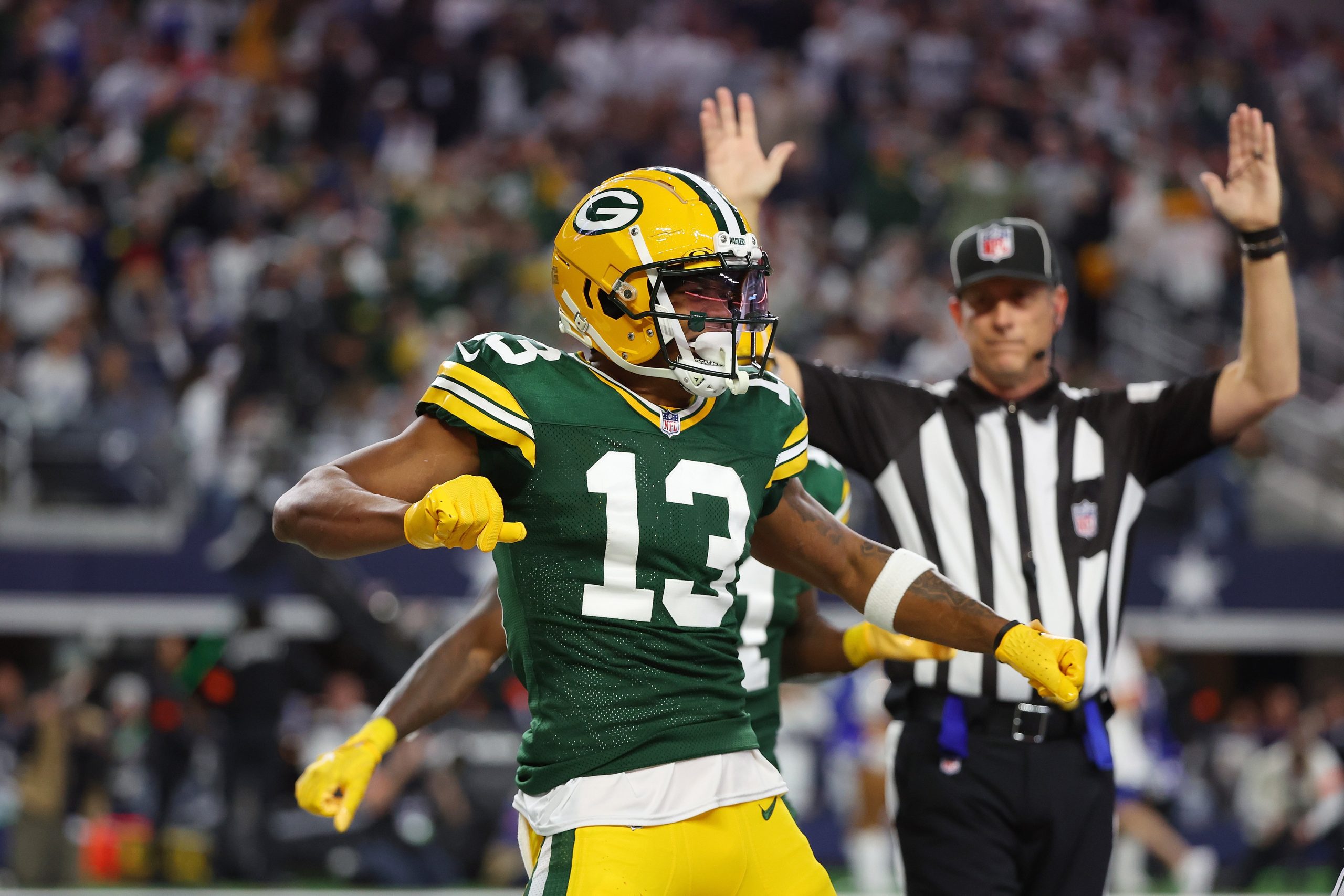 Dontayvion Wicks celebrates a touchdown